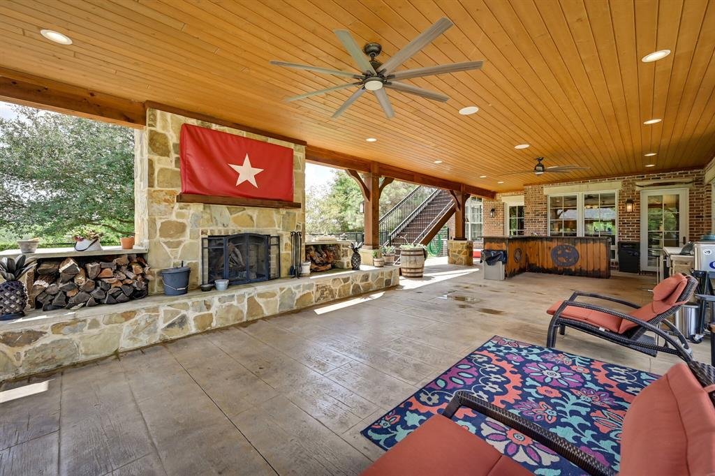 Covered outdoor patio with fireplace