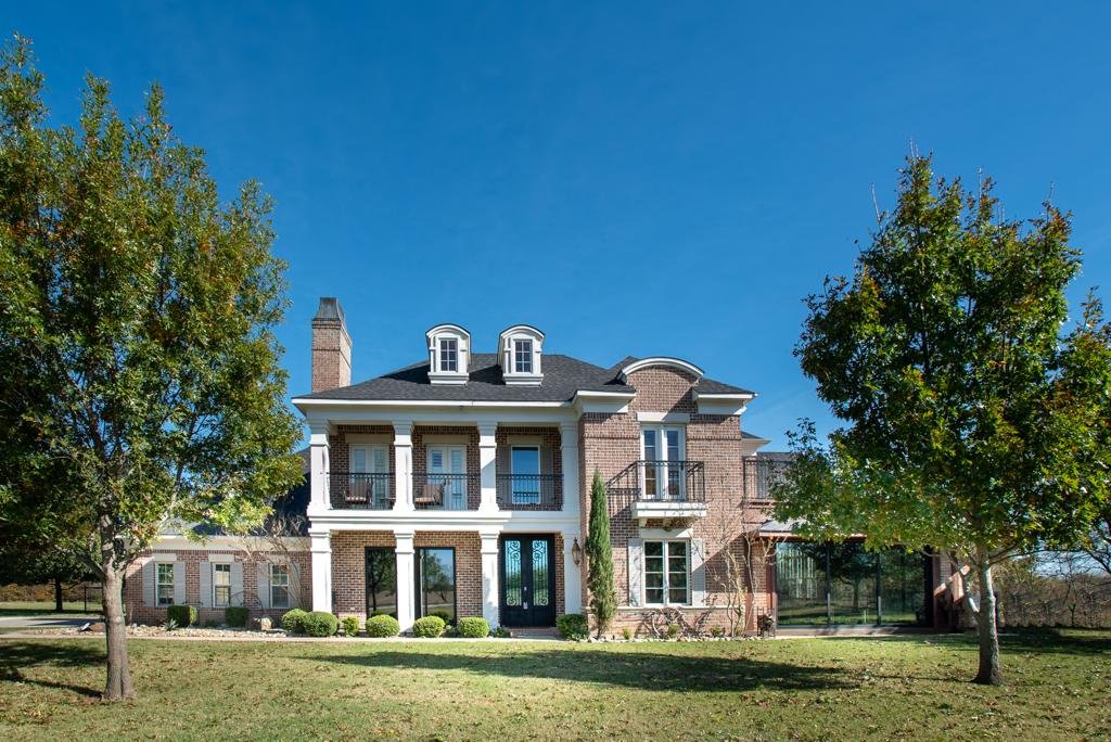 Front exterior of the luxury lakeside estate in Sanger Texas